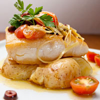 baked fish with potatoes and cherry tomatoes